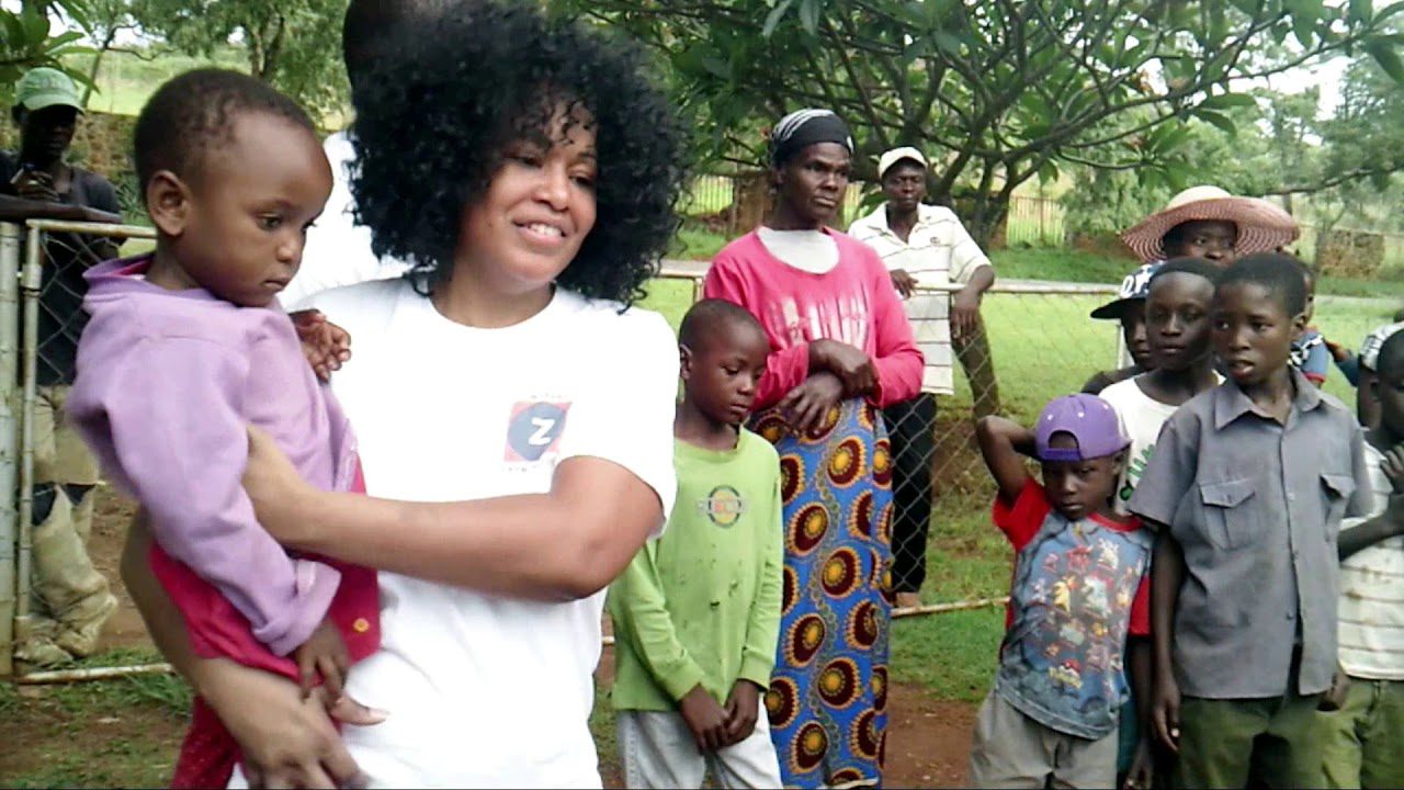 Ayanna Nahmias holding baby during project oversight trip.